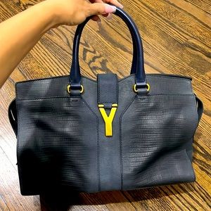Navy blue, medium size Yves Saint Laurent bag.